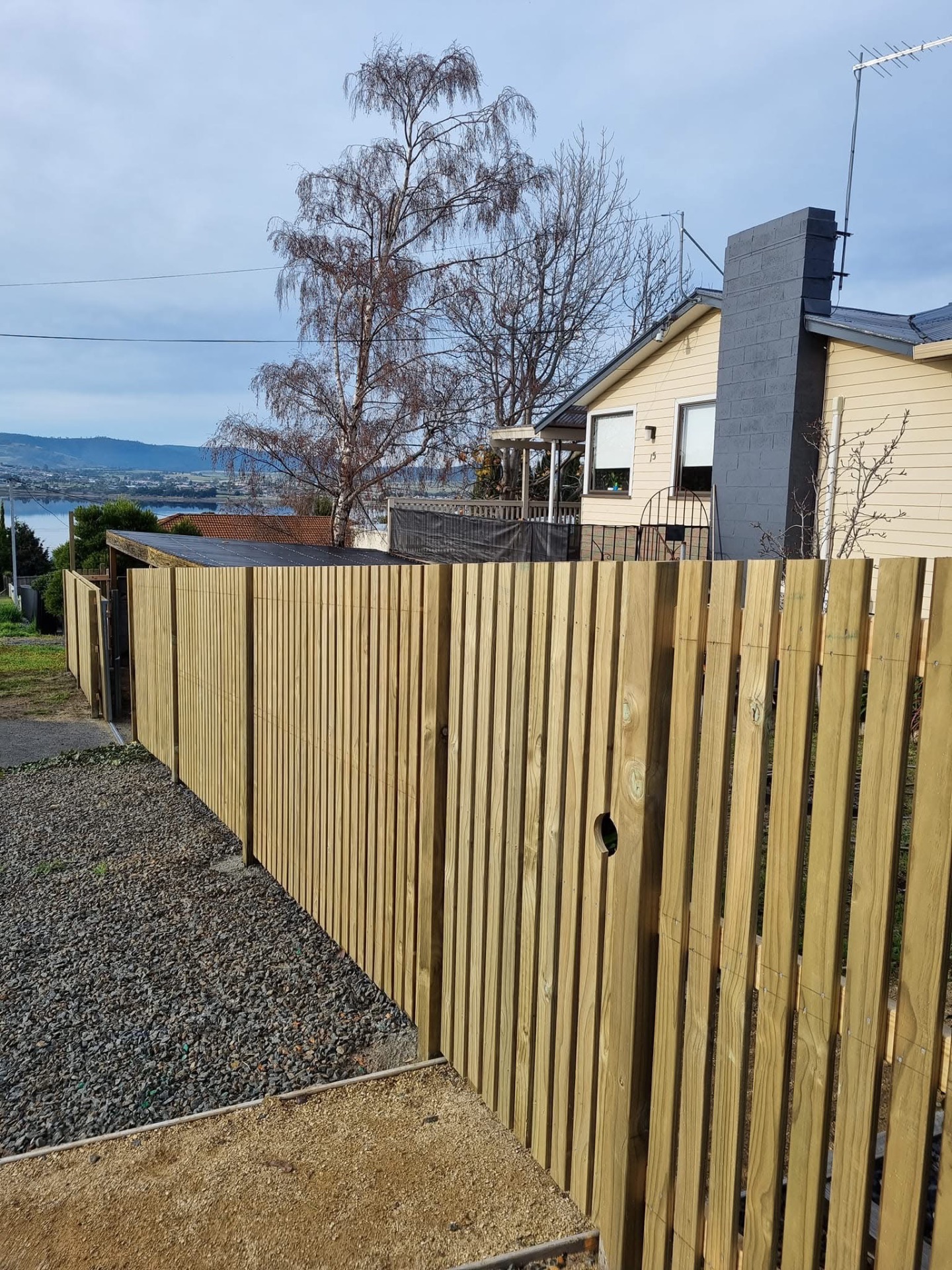 New timber paling fence along a suburban home in Hobart, Tasmania